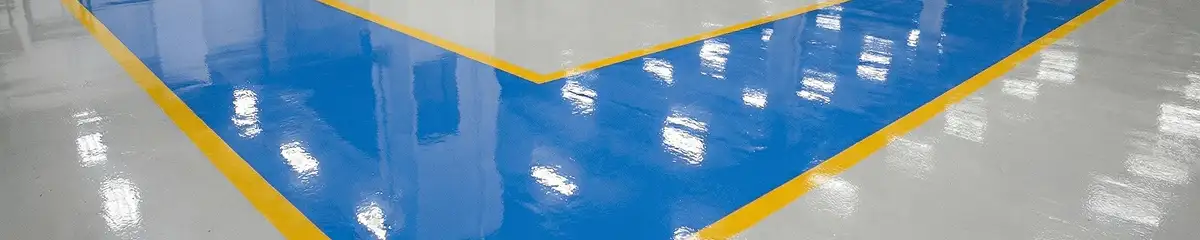 A factory floor professionally covered and marked with epoxy flooring in Manchester, NH