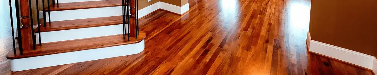 Base floor of a staircase with professionally restored wood flooring in Manchester NH