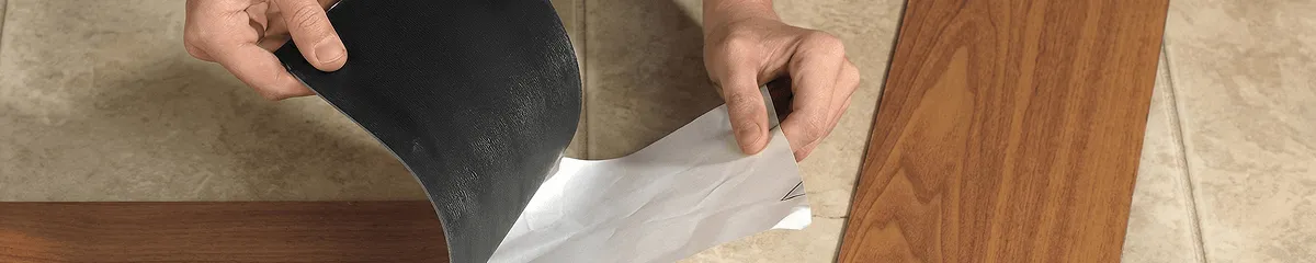 A professional installing vinyl flooring in Manchester, NH