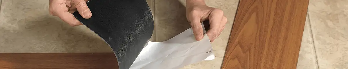 A professional installing vinyl flooring in Manchester, NH